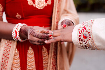 Indian, bride and hands with ring, groom and morning with henna, luxury and culture for woman....