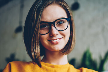 Half length portrait of attractive successful female entrepreneur in stylish eyeglasses with black...