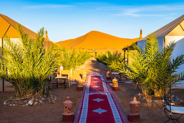 Luxury tent camp at Erg Chebbi Sahara desert at sunrise near Merzouga town, Morocco, North Africa