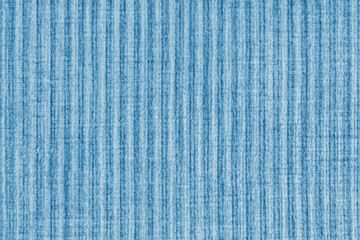 Ridge texture background of velour corduroy blue cloth. Large ribbed, coarse weaving velveteen,...