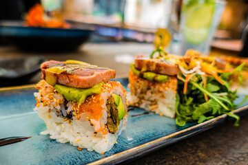 Overhead view of platter of sushi rolls