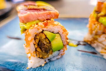 Overhead view of platter of sushi rolls