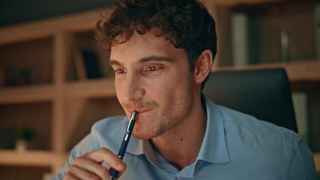 Smiling entrepreneur making notes in copybook inspired by business ideas closeup