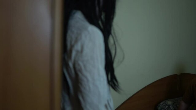 The vengeful ghost of his girlfriend follows a young man into his apartment,A ferocious female ghost stalks people.