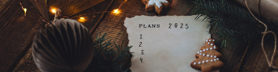 Writing new year resolutions 2025 by hand in December on New Year's Eve. Plan, goals, ideas,...
