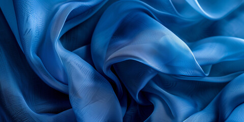 Blue fabric with delicate folds. Silk satin fabric backdrop with copy space.