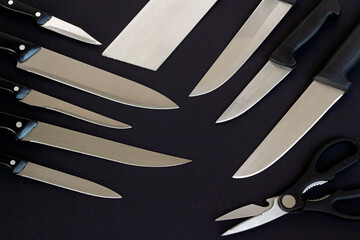 Unused,new knife set of different knives designed on black surface.Conceptual image