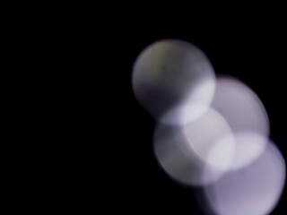 Light color light leak on dark background for design use and special effects.