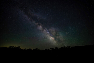 Milky Way galaxy with mountain silhouette