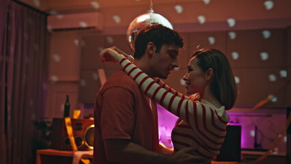 Happy lovers dancing party in empty apartment close up. Romantic couple date 