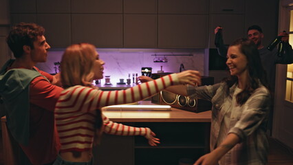 Friends hugging evening meeting home closeup. Happy colleagues greeting at night