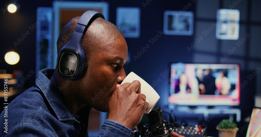 Poster african american show host recording podcast with guest, using analog mixer and professional mic in 