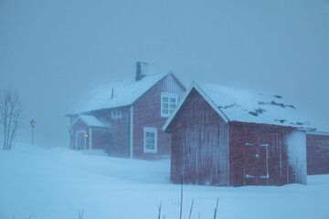 Swedish red houses in one of the strongest snowstorms of 2024, Hemavan, Sweden