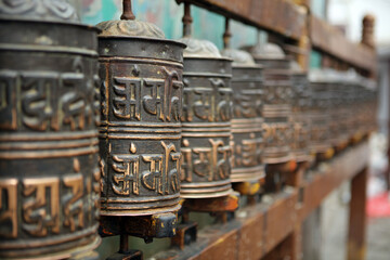 Sacred buddhist prayer wheels in the temple in Kathmandu, Nepal