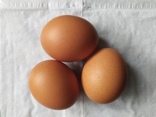 three chicken eggs
