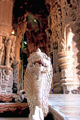 The stone serpent sculpture in the temple combines history, myth, craftsmanship, and culture