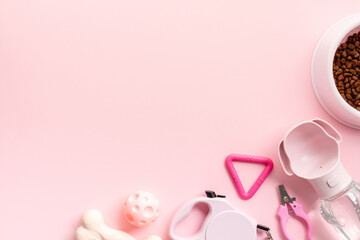 Fototapeta premium Stylish pet care supplies on pastel pink background. Pet care, grooming, training concept. Flat lay, top view.