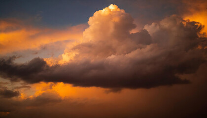 sunset with orange clouds parting to reveal blue sky