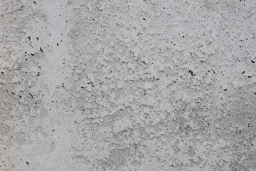 A wall with a lot of holes and a lot of texture