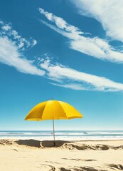Yellow umbrella on sandy beach