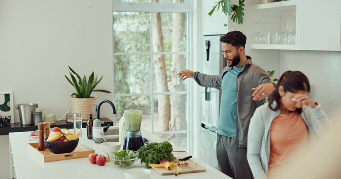 Couple, home and feeding fruit in kitchen, blender and smoothie mess or accident with relationship partners. Vegetables, fruits and nutrition meal replacement in liquid, mistake and vitamin drink