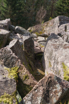 Rock formation at the forest in the Vosges Mountains on a sunny winter day, Alsace, France