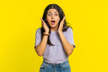 Oh my God, Wow. Excited amazed winner woman raising hands in surprise looking at camera with big...