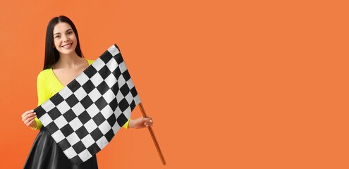 Pretty young woman holding racing flag on orange background with space for text