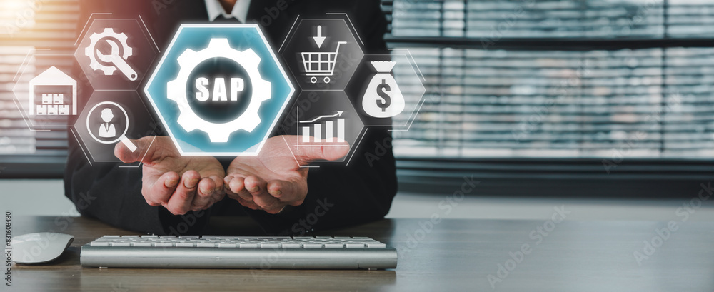 Aufkleber sap, system software automation concept, businessman hand holding sap icon on virtual screen, busine
