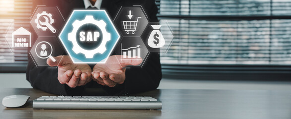 SAP, System Software Automation concept, Businessman hand holding SAP icon on virtual screen,...