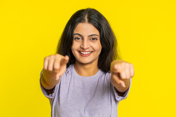 I choose you. Indian smiling woman pointing finger to camera and looking with playful happy...