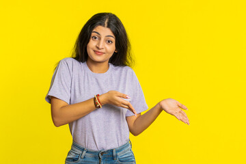 Woman raising hands asking what why reason of failure, demonstrating disbelief irritation by...