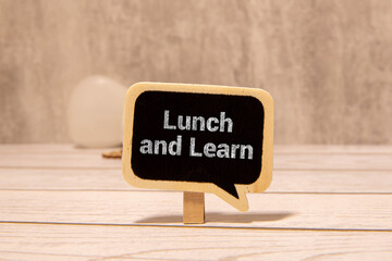 Hand writing the text: Lunch and Learn