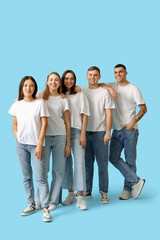Obraz premium Group of young people in stylish jeans on blue background