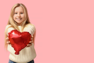 Cute little girl with heart shaped air balloon on pink background. Valentine's day celebration