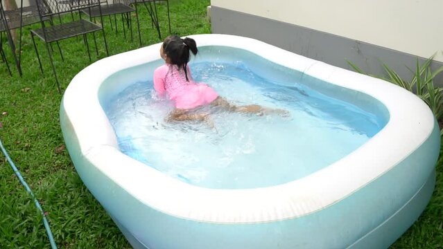 Little girl swimming with inflatable pool with fun,Time for relax on holiday,Summer