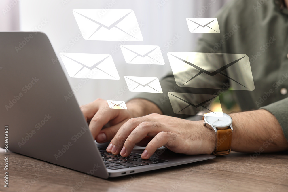 Poster man typing on laptop at table indoors, closeup. many illustrations of envelope as incoming messages 