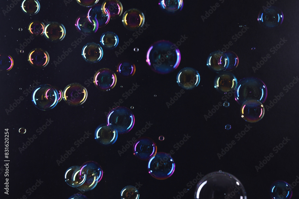 Sticker Beautiful transparent soap bubbles on dark background