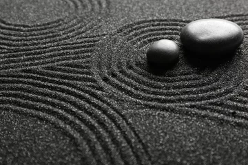 Fotobehang Zen Stenen Spa stones on black sand with lines, closeup. Zen concept  © Pixel-Shot