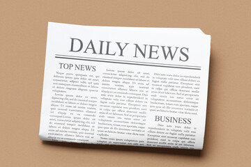 Daily newspaper on brown background