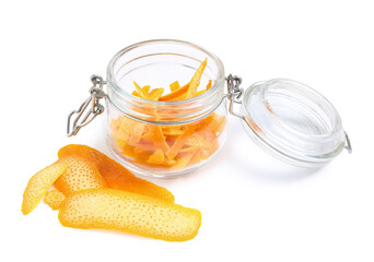 Glass jar with fresh orange peel on white background
