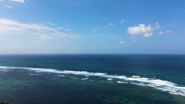 Aerial view of ocean waves in Tanah Barak beach, Bali, Indonesia