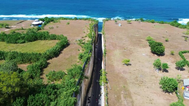 Aerial view of Tanah Barak cliffs, A must-visit viral hidden gem tourist destinantion in South Kuta, Bali, Indonesia