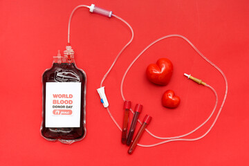 Composition with blood pack for transfusion with text WORLD BLOOD DONOR DAY 14 JUNE, hearts and...