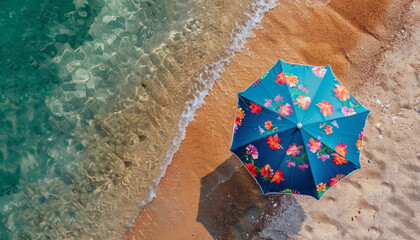 Naklejka premium floral beach umbrella on sandy coast with clear waters