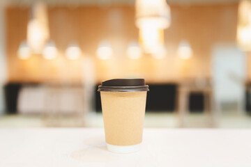 A cup of coffee in the morning on the table. Concepts of Lifestyle Coffee Shop is the perfect place to meet family or friends for a relaxing breakfast.
