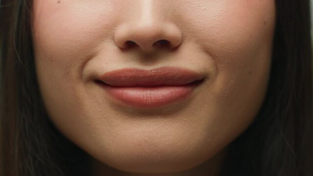 Happy face Asian woman close up lips mouth smiling female chinese korean japanese girl student businesswoman model lady cheerful emotion smile healthy moisturized skin lipstick makeup beauty cosmetics
