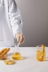 Design template of ginseng experiment theme, a beaker contains a soaked ginseng, some petri dishes...