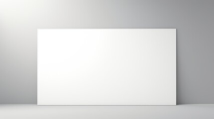 Blank white canvas mockup on a grey background with soft lighting. Perfect for showcasing your designs or artwork.