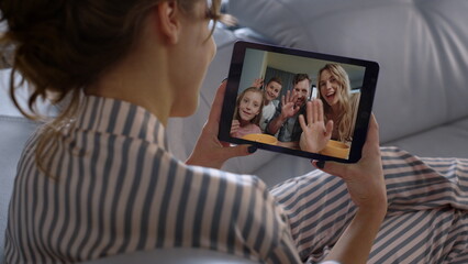 Student talk family online at home shoulder view. Closeup friends waving hands